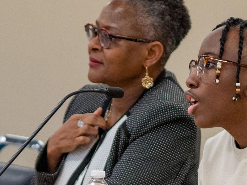 Student and Chancellor on panel